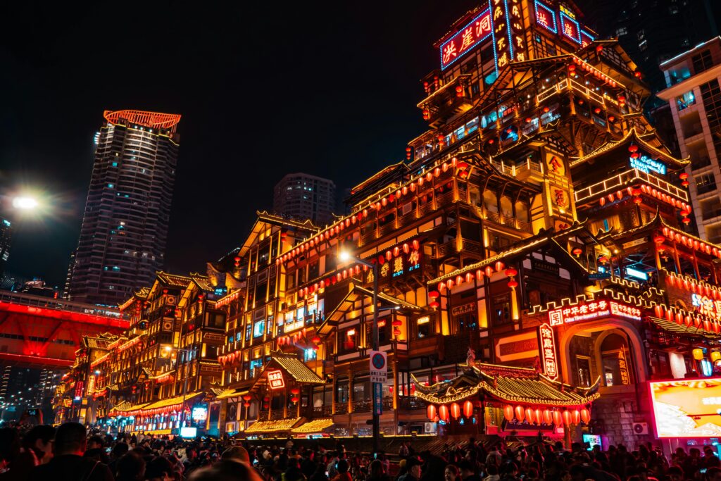 pexels photo 30606159 30606159 Vibrant view of Hongya Cave in Chongqing, China lit up at night, showcasing traditional Chinese architecture.